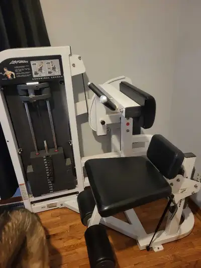 Home gym equipment abdominal crunch with 200lbs ,arm curl with 105lbs universal with 150lbs .bench p...