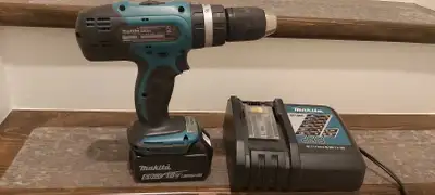  Makita hammer drill with battery and charger. , View more