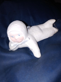 1 hand made ceramic little baby laying down relaxing