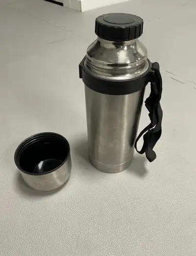 Stainless steel Food/Beverage container 11 inch tall In lid, outer lid, and strap Asking $10