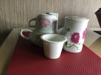 Tea pot and tea cup with lid.