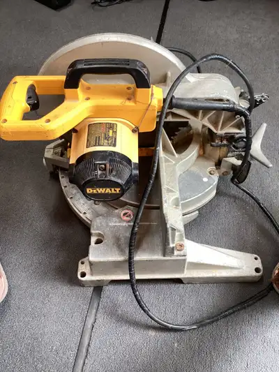 The DEWALT 15 amp 12-inch Sliding Compound Miter Saw is driven by a powerful motor for advanced cutt...