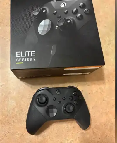 xbox elite series controller mint in box comes with cable and ALL accessories all 4 paddles and all...