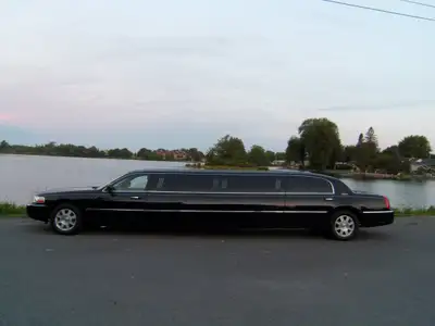 Stretched Limousine made by Executive Coach Builders, 8 passenger rear, front driver seat, divider,...
