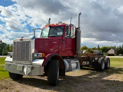 This fleet truck is ready for grain box, deck, silage box 2007 Tandem Pete 378 pre emissions C13 cat...