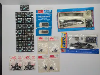 Selling a number of N Scale track accessories. All are new in package other than the Atlas Switch Co...