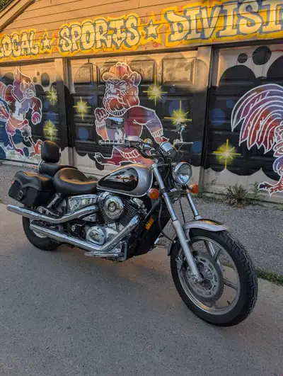 Honda Shadow Spirit 1100 Great on fuel, cheap insurance, good first bike. Comes with a windshield, s...