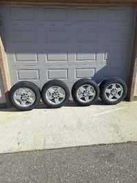 Four rims and tires from 2015 GMC 2500