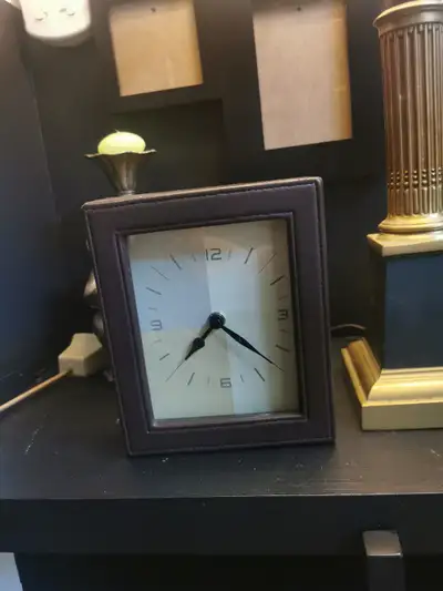 New clock in leather fame, extremely quite , $10, View more