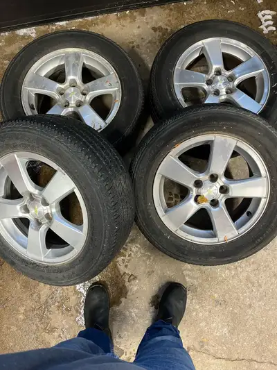 Set of 4 rims and tires with centre caps. 215 60 R16 Wheels came off of a 2014 Cruze. 5 x 105 bolt p...