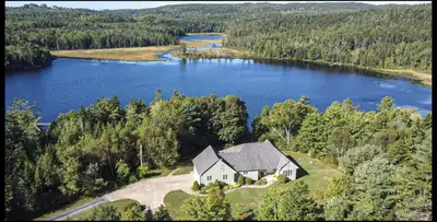 122 Goat Lake Road is a lakeside waterfront property with 1600 FT of lake frontage on Henneberry Lak...