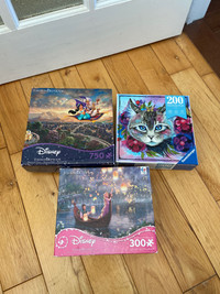 Thomas Kinkade Disney and Ravensburger puzzles