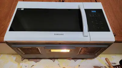 Samsung over-the-range microwave in good working condition. We bought it new last year when the prev...