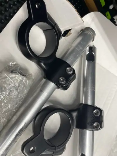For sale is a Triumph Bobber Clip-ons set with the finishers.