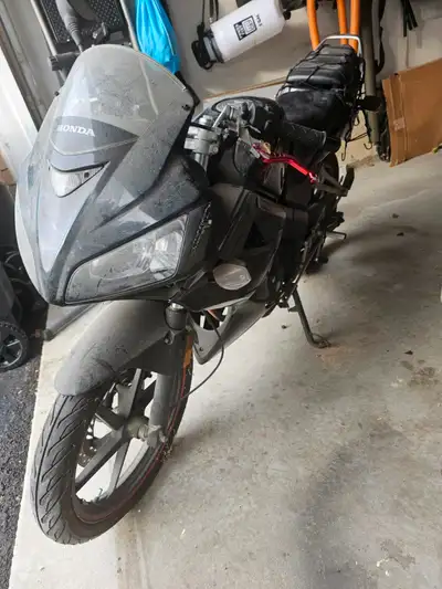 Black Honda CBR125R, been sitting for a couple of years. Now need to just let it go. Comes with a ne...