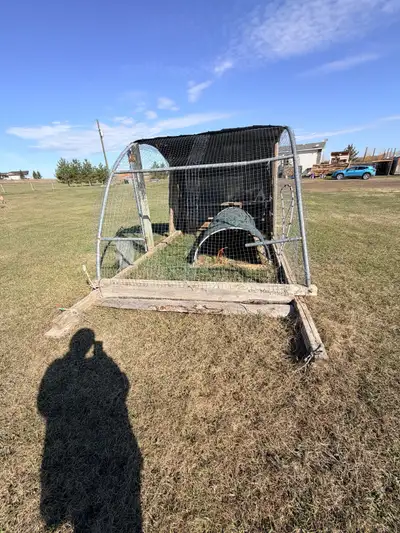 I'm selling my used chicken enclosure, which has served my flock well. It includes a sheltered area...