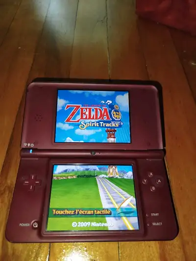 Nintendo DSi XL  burgundy flashée et contient pleins de jeux, View more