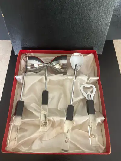 Elevate your home bar with this vintage bar tool set! This set includes a bottle opener, jigger, bar...
