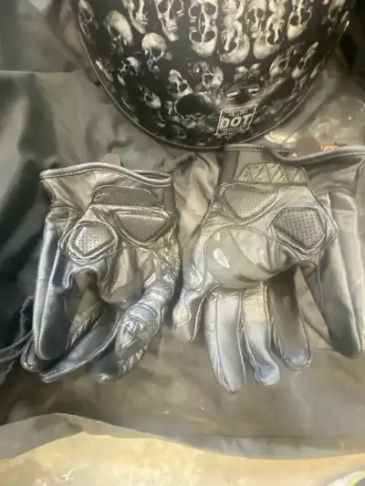 This is a skull patterned motorcycle helmet and dream apparel gloves, in used condition, size large....