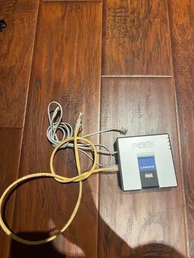 This pre-owned Linksys SPA2102-R Phone Adapter with Router provides reliable VoIP connectivity for y...