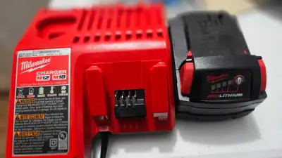 Milwaukee Battery and charger (New), View more