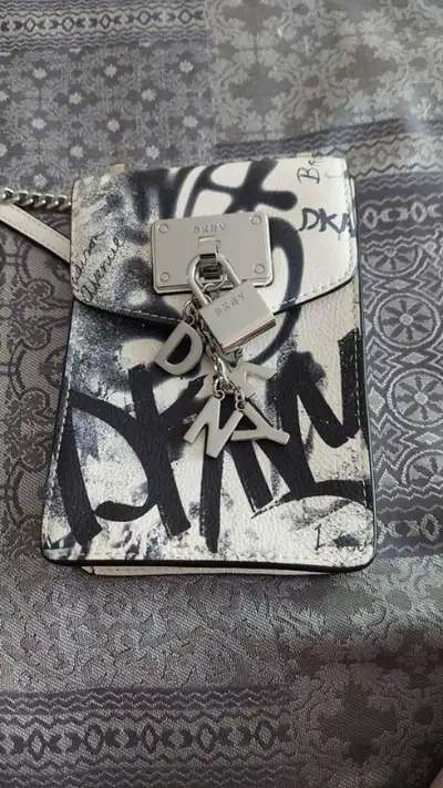 Mini, over-shoulder purse. Shoulder strap can be removed and is adjustable. Excellent condition. Gre...