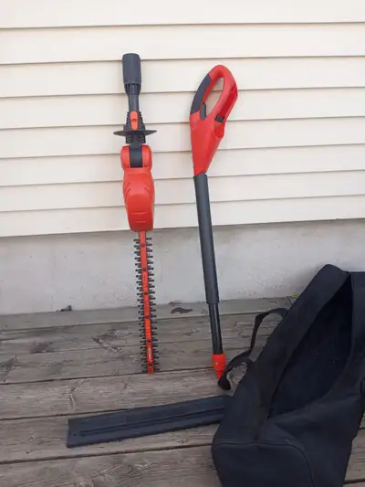 Black and Decker cordless hedge trimmer with storage bag and blade cover. TOOL ONLY