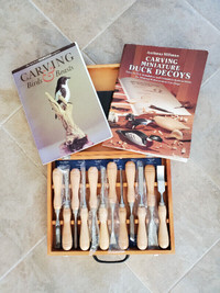 Assorted wood carving tools and books