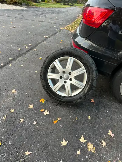 Four 18" Audi Alloy rims with Centre caps- good condition. There are 235/60 R18 tires currently moun...