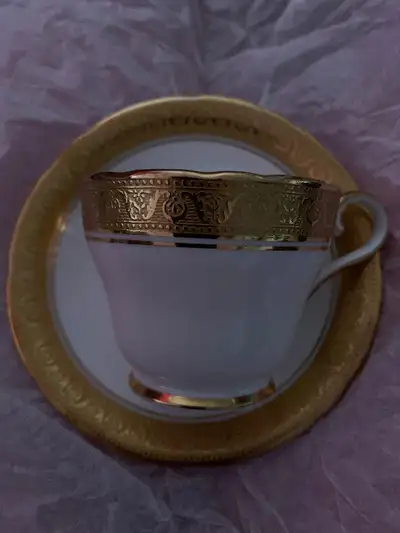 Rare, unique Aynsley heavy gold cup and saucer, no issue, bone china, England. I could not find on t...