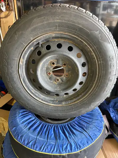I am selling a Rovelo winter tire, size 215/70R16. This used tire is mounted on a steel rim and is r...