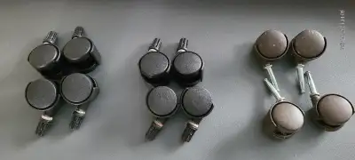 Furniture Castors. 2 Black sets of 4, new, never been used. Brown set, in good used condtion. $5 per...