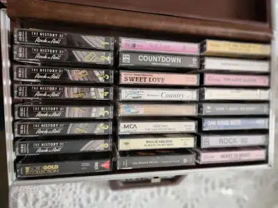 24 cassette tapes of various artists and types of music, View more