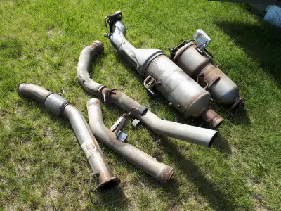 Complete OEM exhaust including downpipe, SCR, DPF and tail pipe. Removed from 2016 RAM 3500 long box...