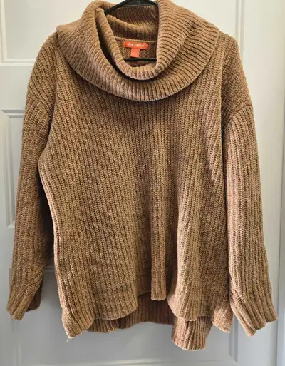 This is a cozy Joe Fresh brown knit sweater, perfect for chilly days. The cowl neck adds a touch of...