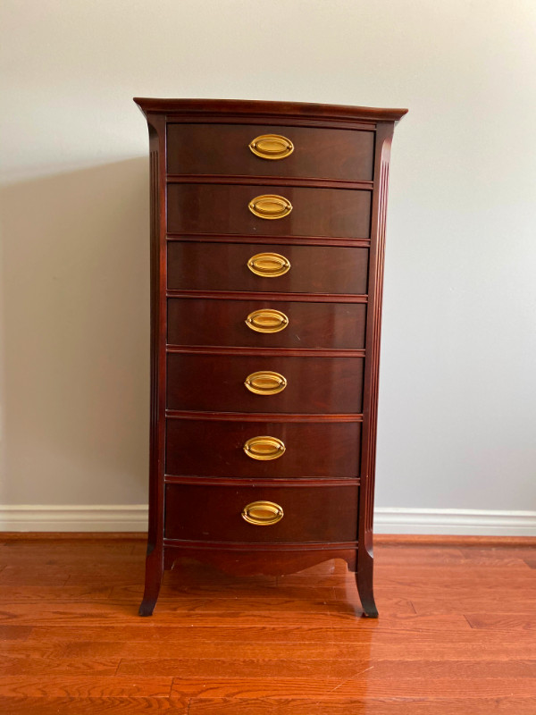 Tall wood dresser with gold hardware. Dressers & Wardrobes Oakville