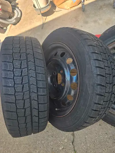 Winter tires on rims off 2007 Ford focus. 2 tires have 2-3 seasons in them, the other 2 tires should...