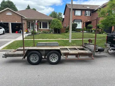 This tandem axle utility trailer measures 14 feet in length by 78 inches in width (deck size) and fe...