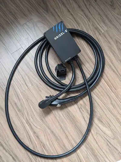 a Grizzl-E Classic EV charger, manufactured on March 5, 2021. It's a 24-amp unit, made in Canada by...