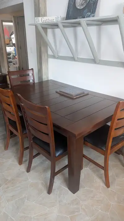 Table and 5 chairs in good condition, View more