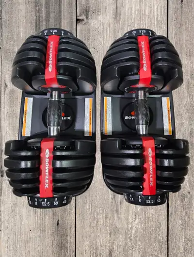 Excellent Condition. All weight options work like brand-new set. Adjustable from 5-52.5 lbs per dumb...