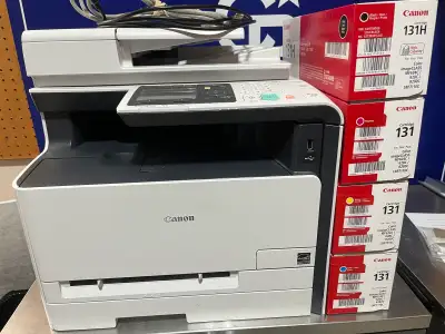 In excellent condition, Canon printer loaded with toner and an entire back up set of toner.