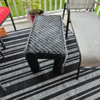 Black wicker table/ stool for outside or inside