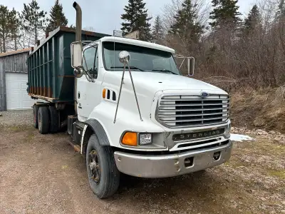 Sterling roll off truck for sale , cable style. runs well with a 3306 CAT , paired with an 8LL with...