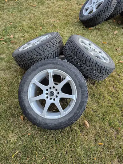 I used these for a few seasons on my 2009 Lancer, they still have good tread on them. Rims in decent...