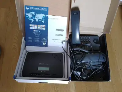 A GrandStream UCM6202 - IPPBX device with 2 x free Linksys SPA901 IP-Phones. UCM was used only for c...