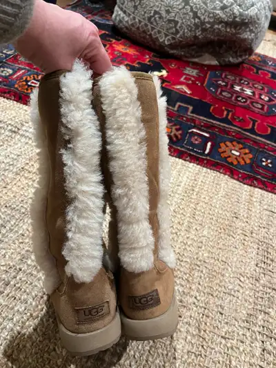 3 pairs of Ugg boots at a great deal. One pair in size 7 (in middle of pic with shearling accent) ne...