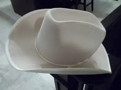 White cowboy hat Has a white ribbon From "Smithbilt", Calgary, Canada Size 6 3/4 In new condition, N...
