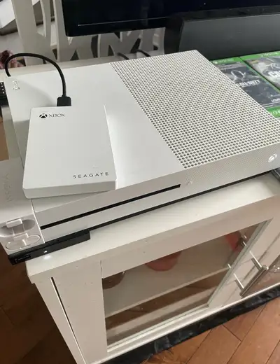Xbox One S in good condition. Comes with: New Xbox Controller Xbox rechargeable battery pack Listed...