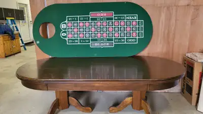 Solid wood table with a removable/reversable top. Can be used for dining, poker and craps. I will ev...